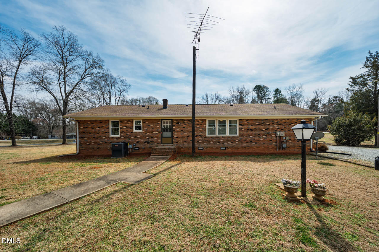 200 Sawmill Road Cedar Grove, NC 27231 - Photo 49 of 72 a front view of a house with a yard covered with snow in front of it