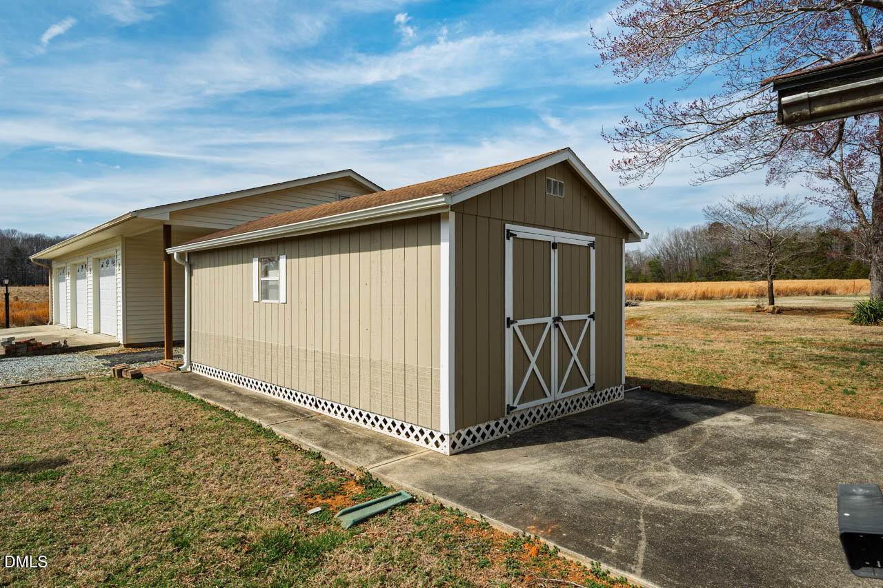 200 Sawmill Road Cedar Grove, NC 27231 - Photo 50 of 72 a view of a house with backyard and wooden fence