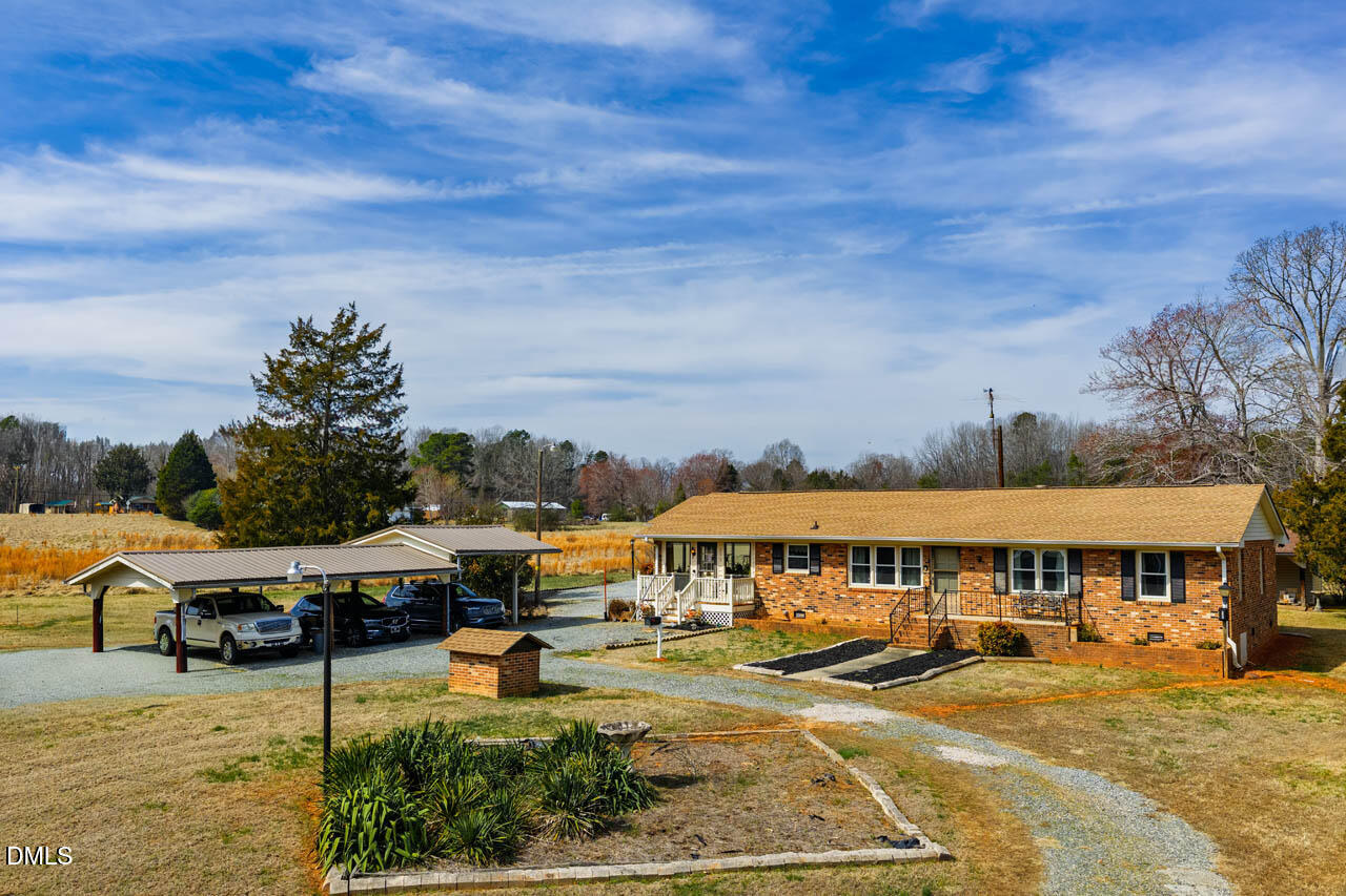 200 Sawmill Road Cedar Grove, NC 27231 - Photo 57 of 72 a view of a swimming pool and lounge chair