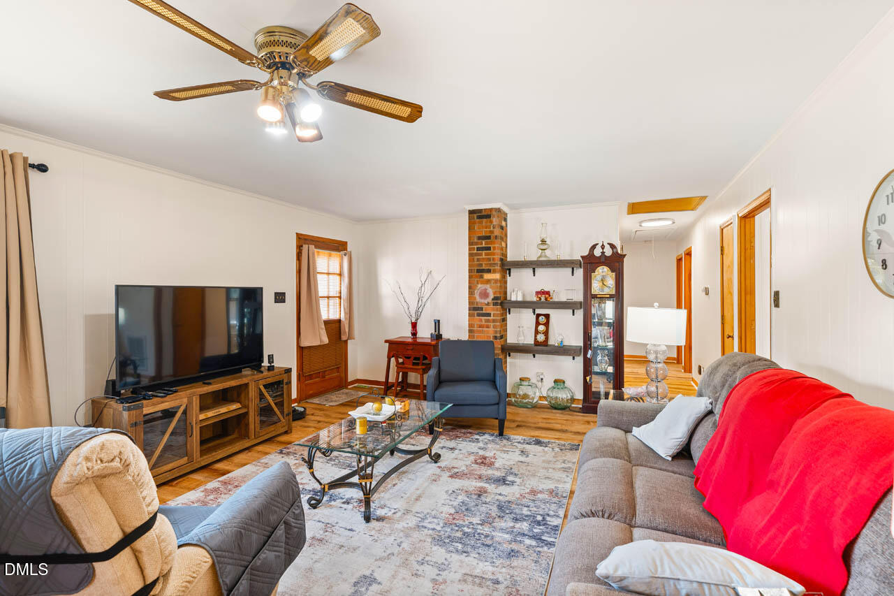 200 Sawmill Road Cedar Grove, NC 27231 - Photo 6 of 72 a living room with furniture and a flat screen tv