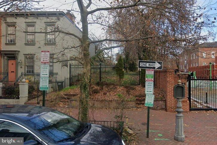 3245 O Street Northwest Washington, DC 20007 - Photo 1 of 9 a street view with tall buildings