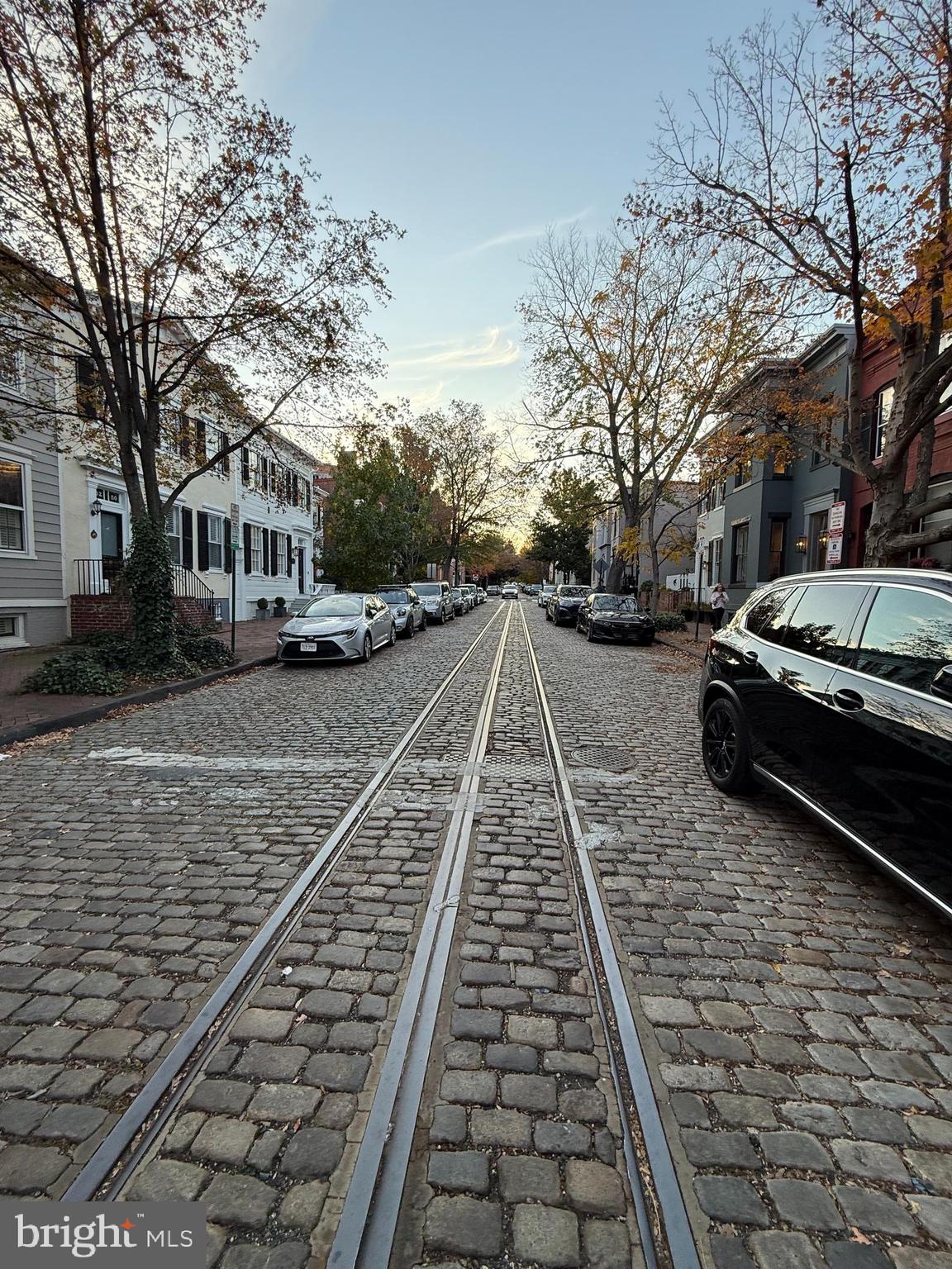 3245 O Street Northwest Washington, DC 20007 - Photo 6 of 9 a view of a yard with cars parked on the roadside