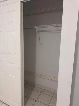 a kitchen with stainless steel appliances a sink a stove a microwave and cabinets