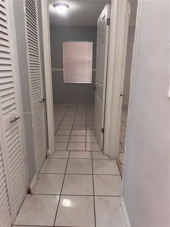 a view of empty room with windows