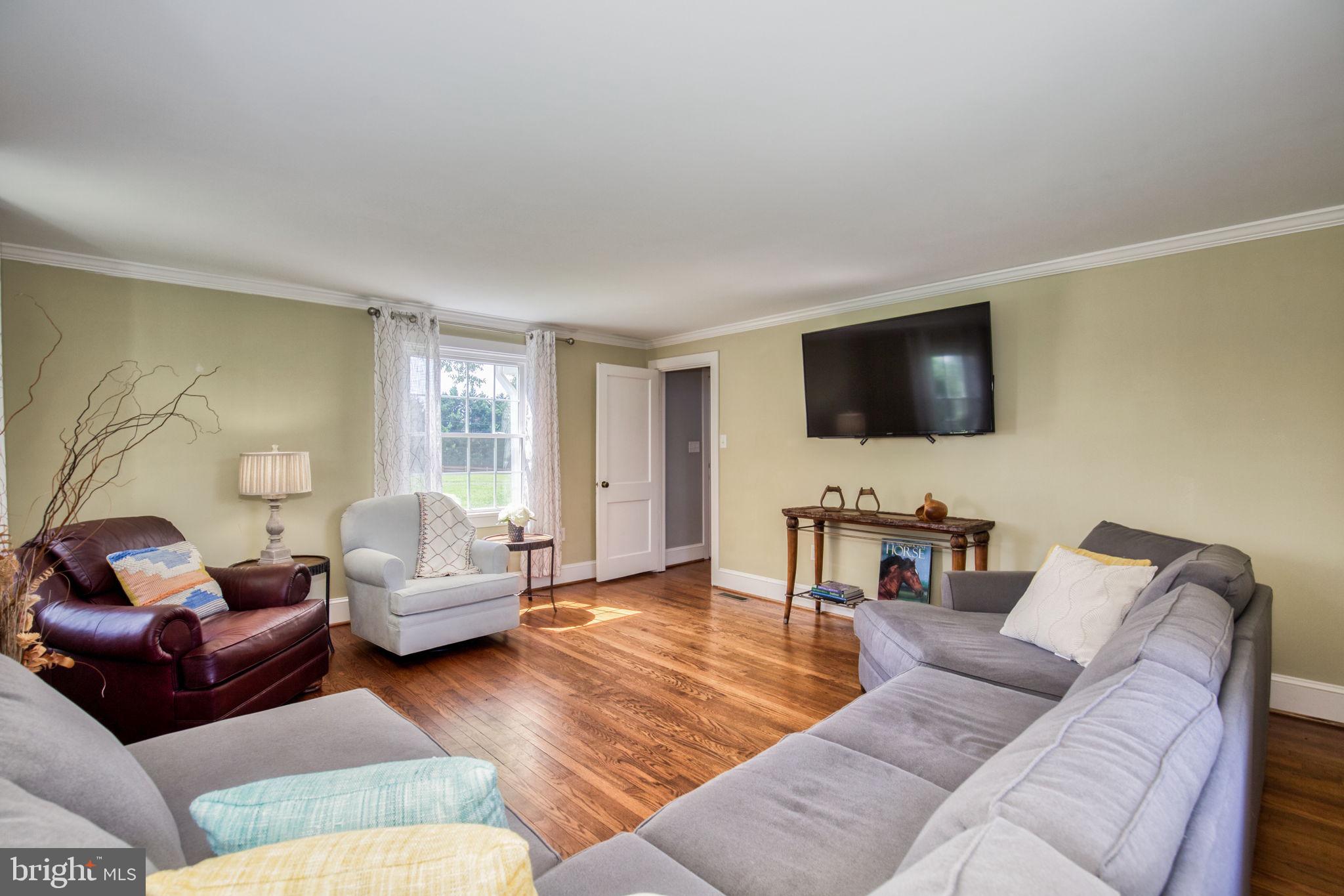 1815 Country Road Beaverdam, VA 23015 - Photo 11 of 92 a living room with furniture and a flat screen tv