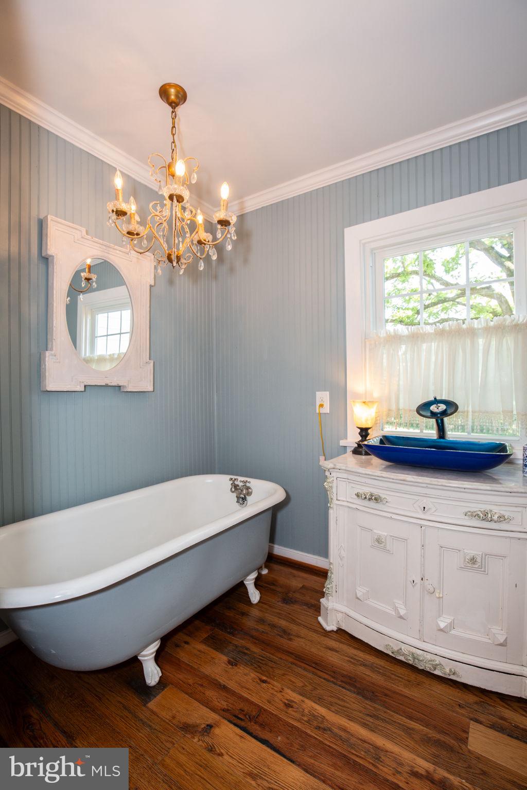 1815 Country Road Beaverdam, VA 23015 - Photo 25 of 92 a bathroom with a sink a toilet a window and mirror