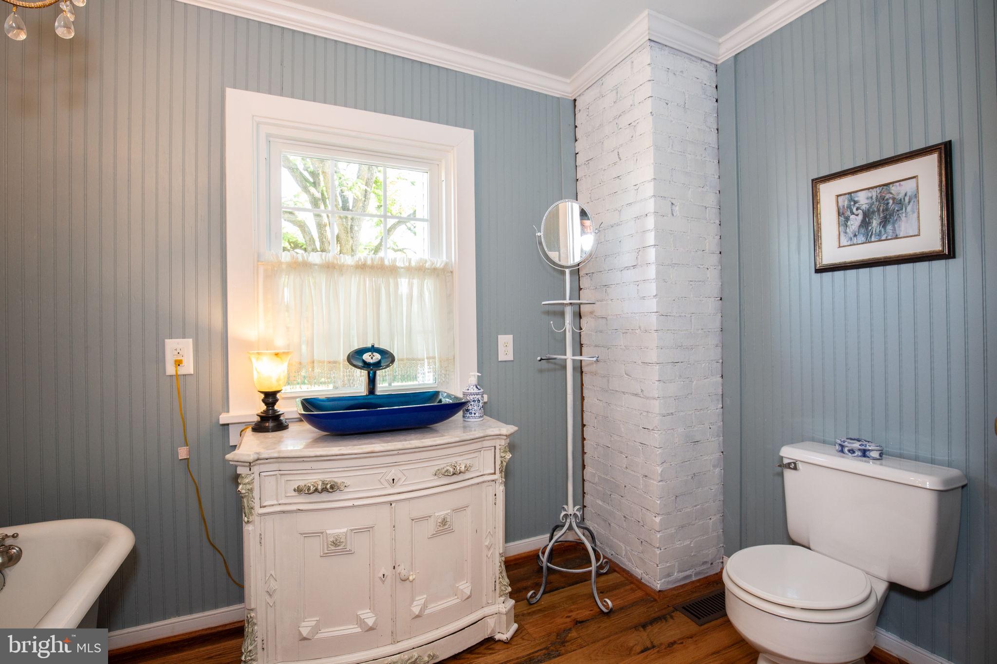 1815 Country Road Beaverdam, VA 23015 - Photo 26 of 92 a bathroom with a toilet a sink and a window