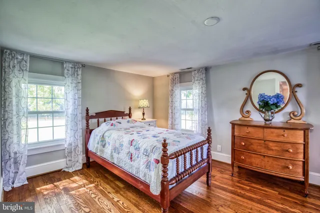 a view of a table and chairs in the garden