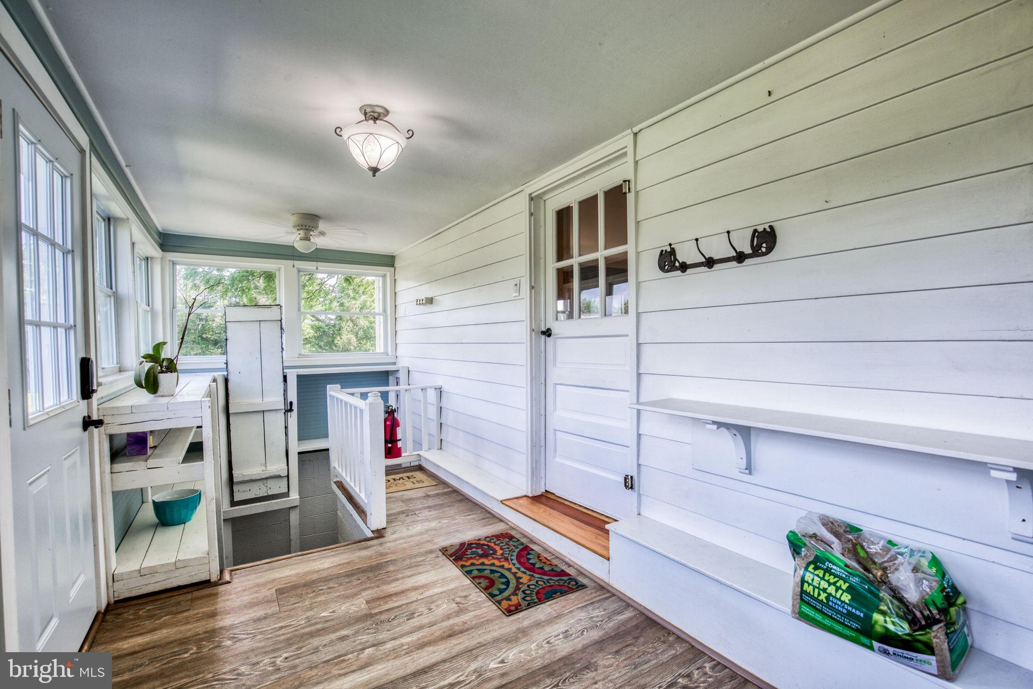 1815 Country Road Beaverdam, VA 23015 - Photo 40 of 92 a living room with furniture and a gate