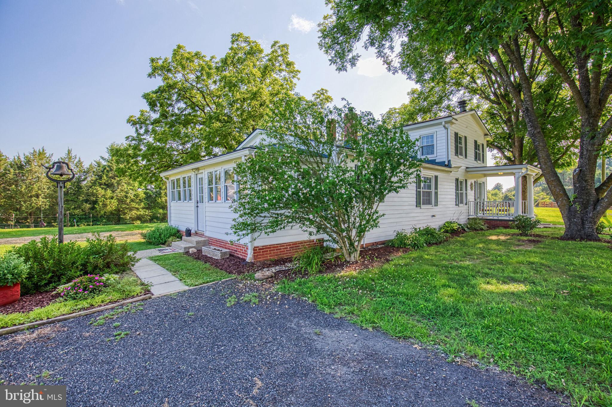 1815 Country Road Beaverdam, VA 23015 - Photo 5 of 92 a front view of a house with garden