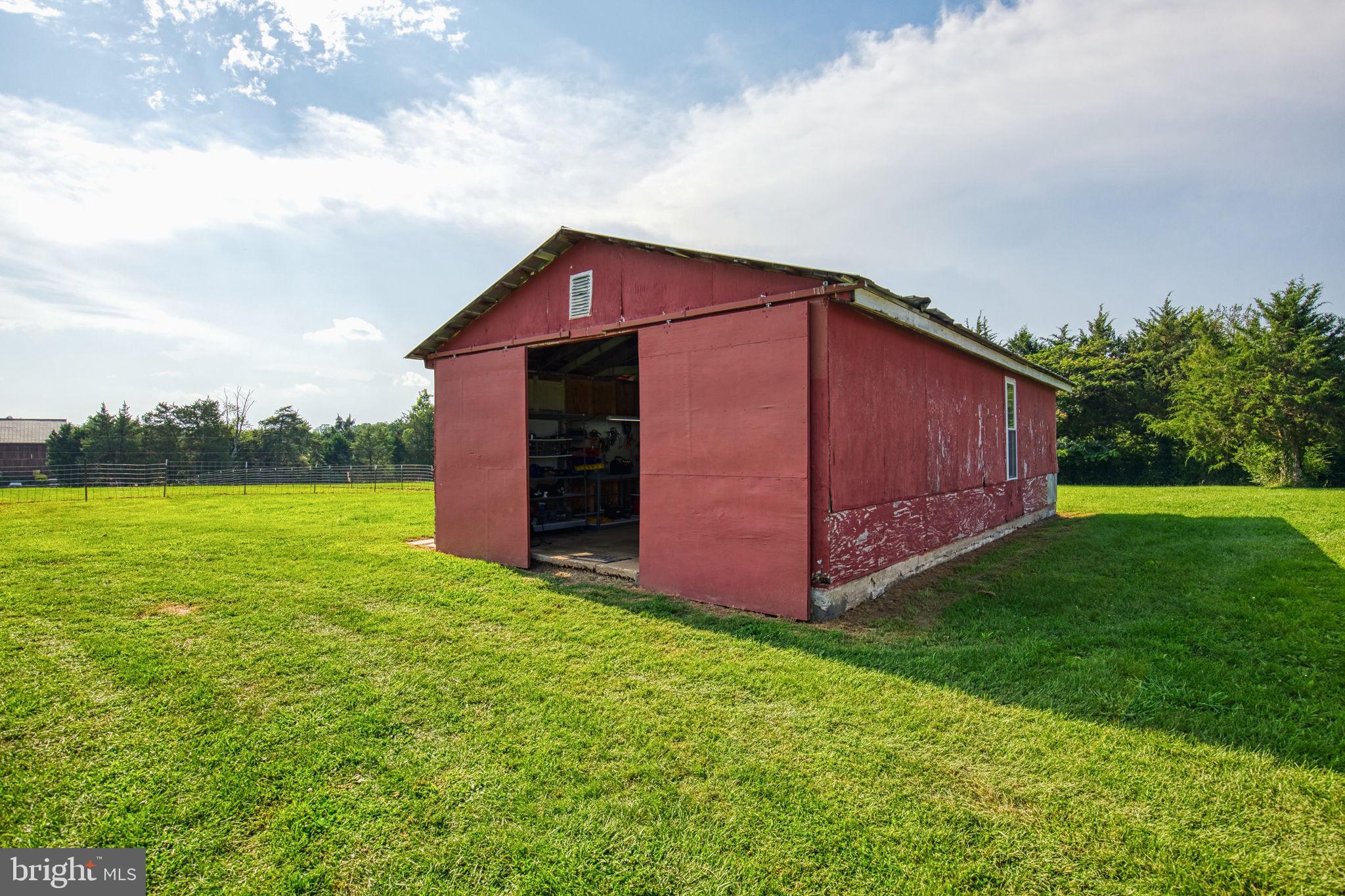 1815 Country Road Beaverdam, VA 23015 - Photo 60 of 92 a view of a backyard with potted plants and large tree