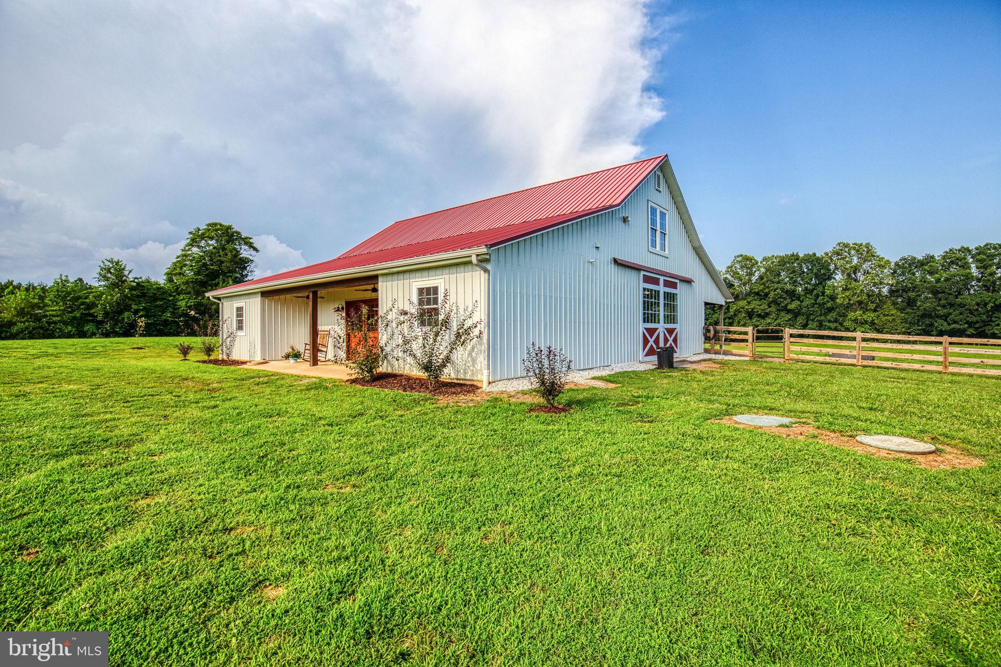 1815 Country Road Beaverdam, VA 23015 - Photo 64 of 92 a backyard of a house with table and chairs