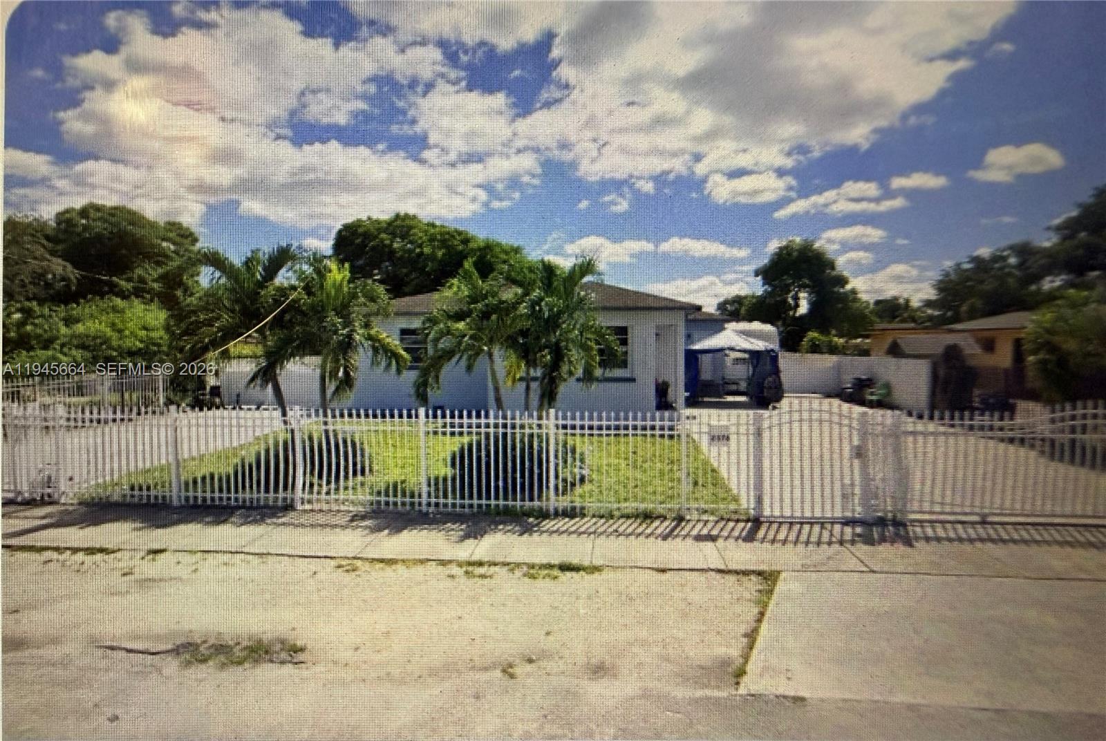 2376 Northwest 104th Street Miami, FL 33147 - Photo 2 of 7 a view of a yard with swimming pool