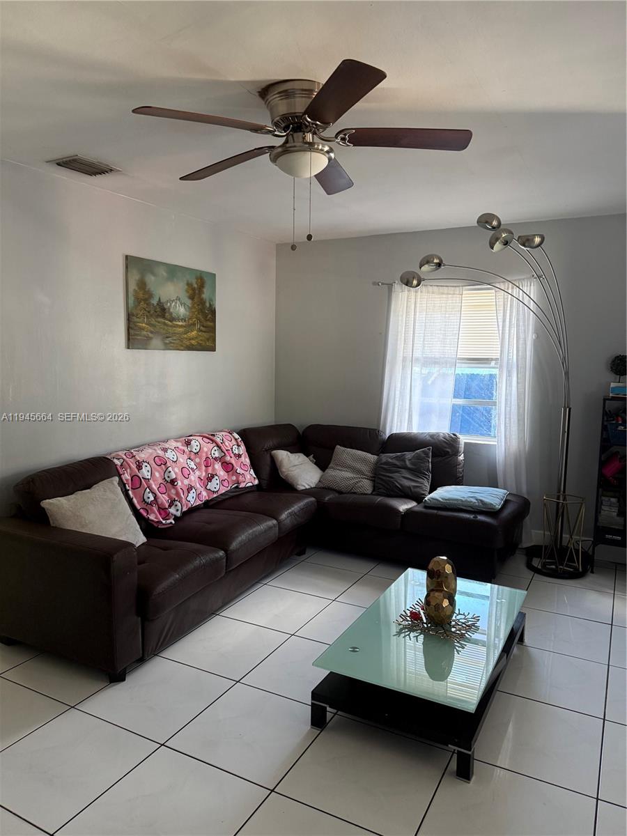 2376 Northwest 104th Street Miami, FL 33147 - Photo 6 of 7 a living room with furniture and a window