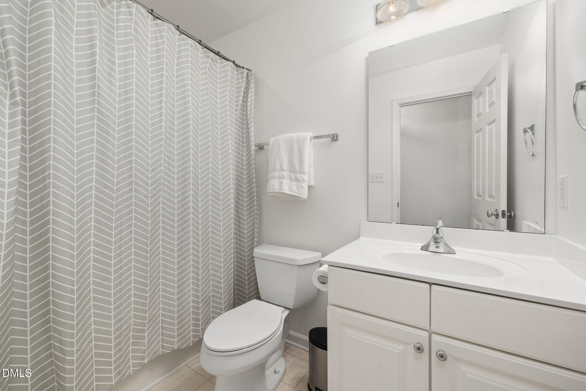 5109 Middleton Road Durham, NC 27713 - Photo 28 of 39 a bathroom with a sink toilet and vanity