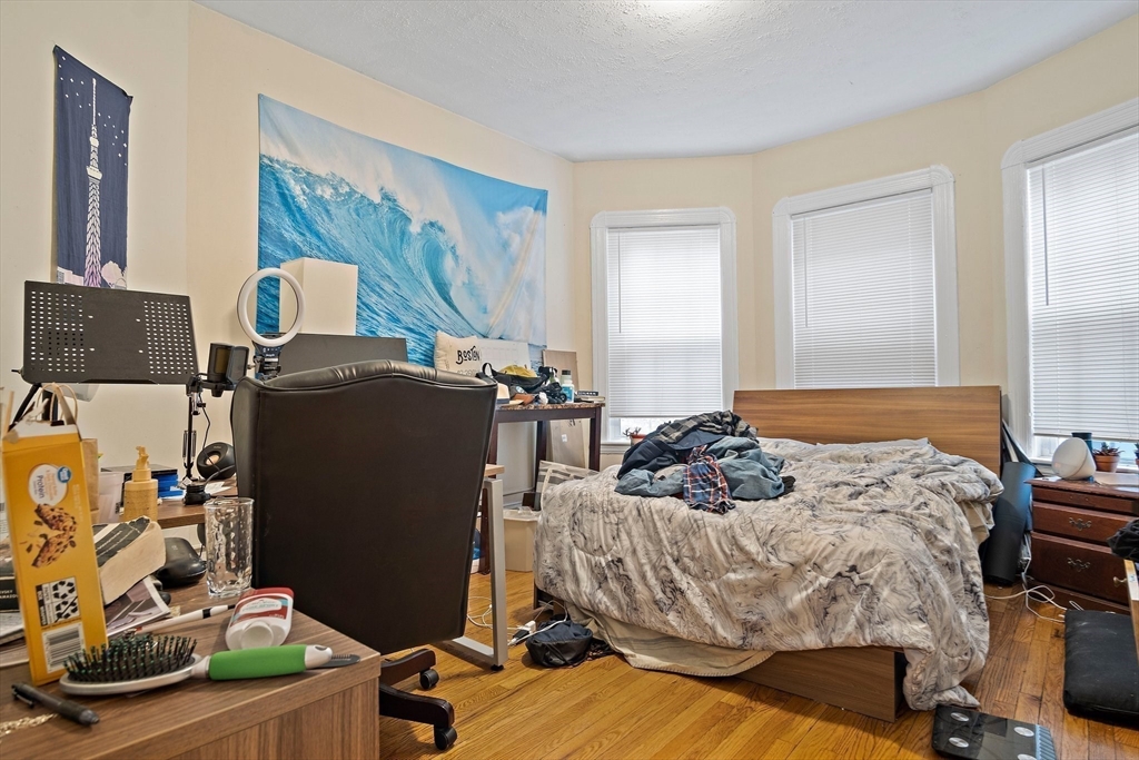 852 Huntington Avenue, Unit 2 Boston, MA 02115 - Photo 11 of 15 a bedroom with bed and a window