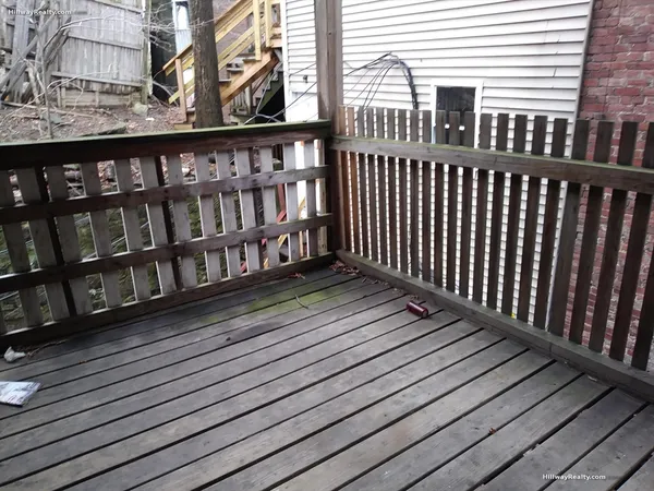 a balcony with wooden floor