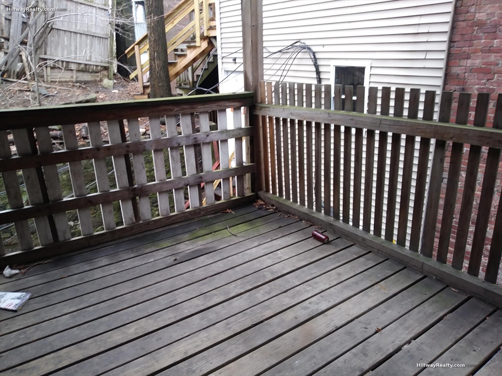 852 Huntington Avenue, Unit 2 Boston, MA 02115 - Photo 15 of 15 a balcony with wooden floor