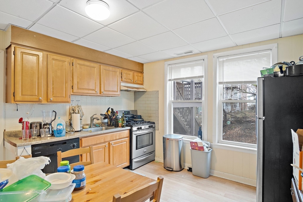 852 Huntington Avenue, Unit 2 Boston, MA 02115 - Photo 3 of 15 a kitchen with a refrigerator and cabinets