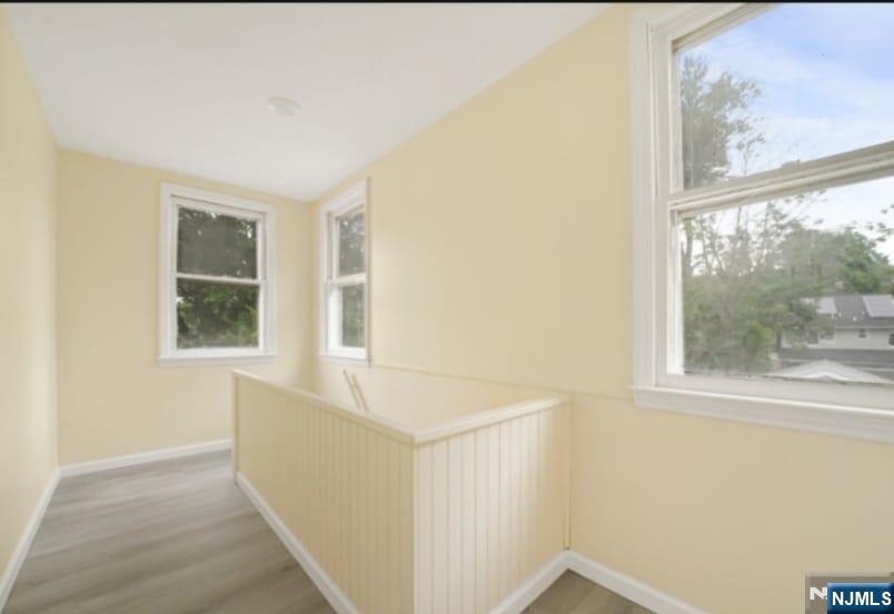 125 Birch Street, Unit 2 Bloomfield, NJ 07003 - Photo 4 of 11 a view of an empty room with a window