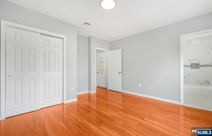 125 Birch Street, Unit 2 Bloomfield, NJ 07003 - Photo 9 of 11 a view of empty room with wooden floor