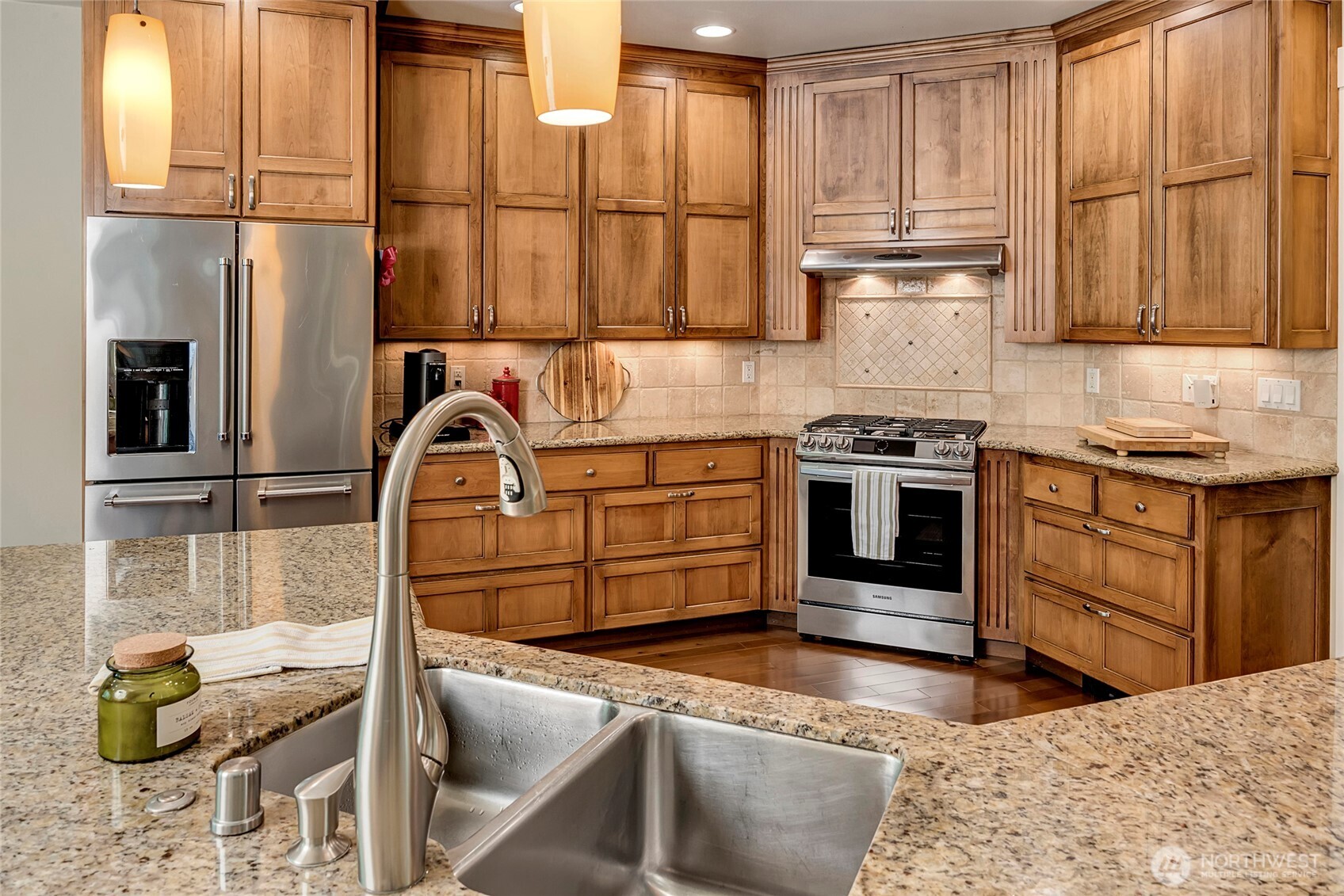 8211 Spada Road Snohomish, WA 98290 - Photo 12 of 35 a kitchen with stainless steel appliances granite countertop a stove a sink and a microwave