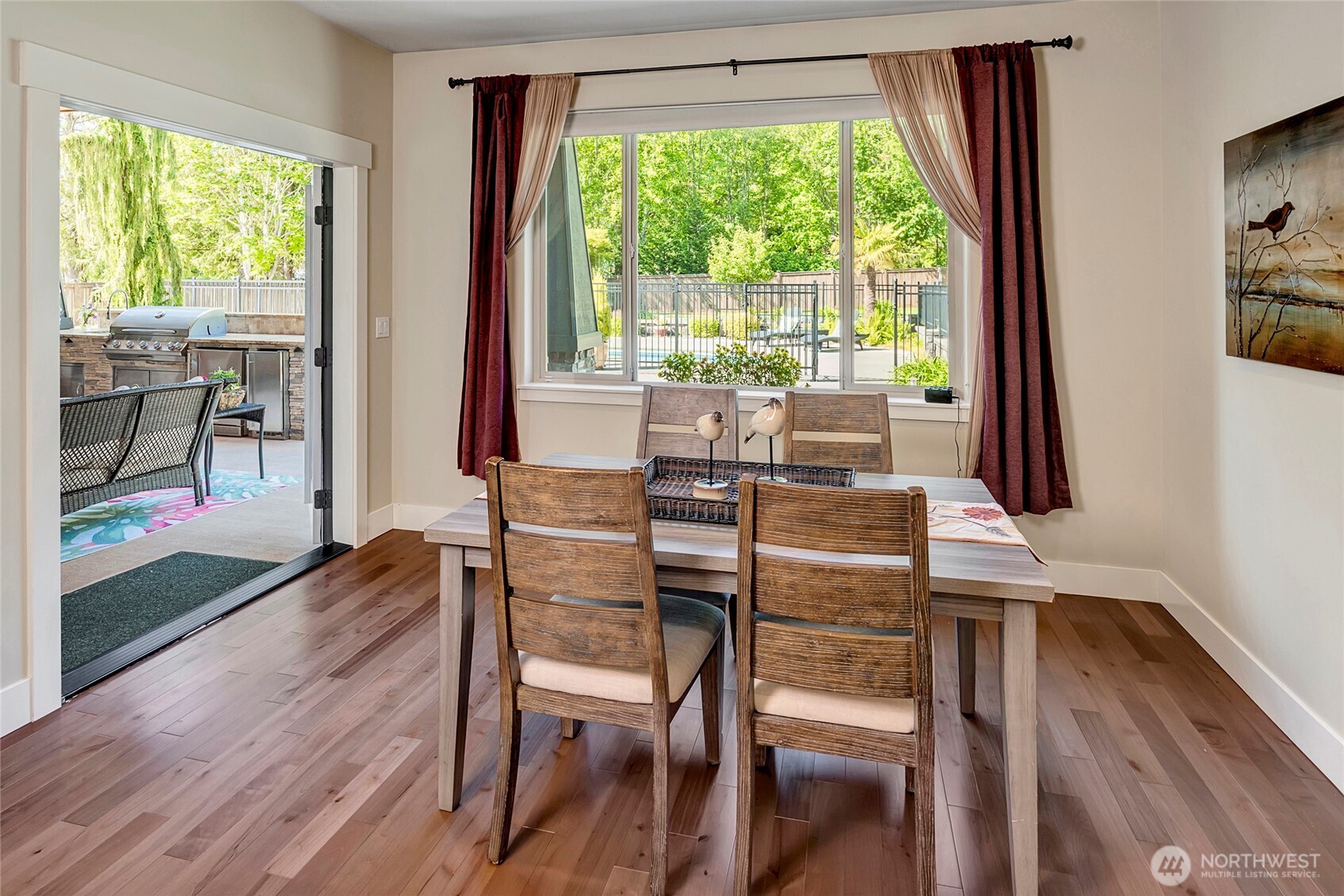 8211 Spada Road Snohomish, WA 98290 - Photo 13 of 35 a view of a dining room with furniture window and wooden floor