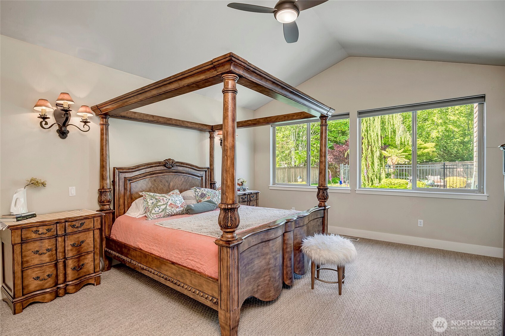 8211 Spada Road Snohomish, WA 98290 - Photo 15 of 35 a bedroom with a bed and a chandelier