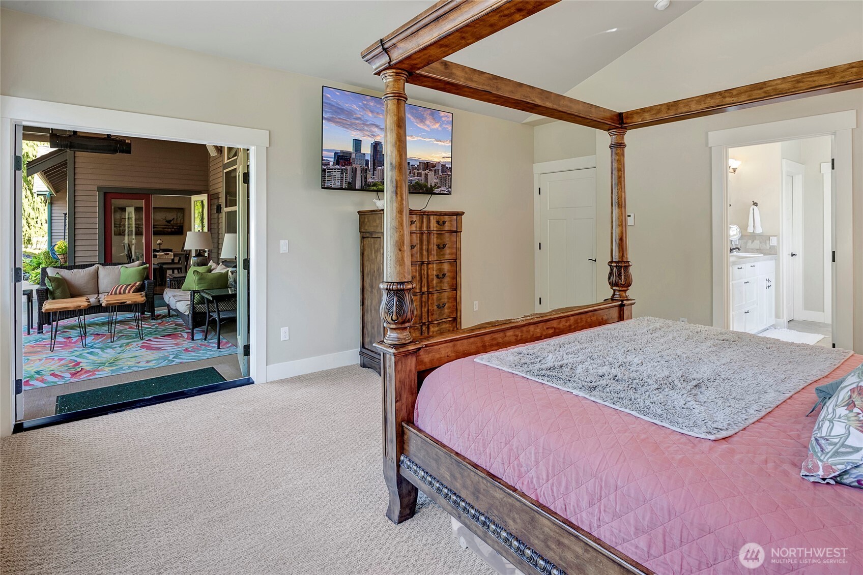 8211 Spada Road Snohomish, WA 98290 - Photo 16 of 35 a bedroom with a bed and a dresser with mirror