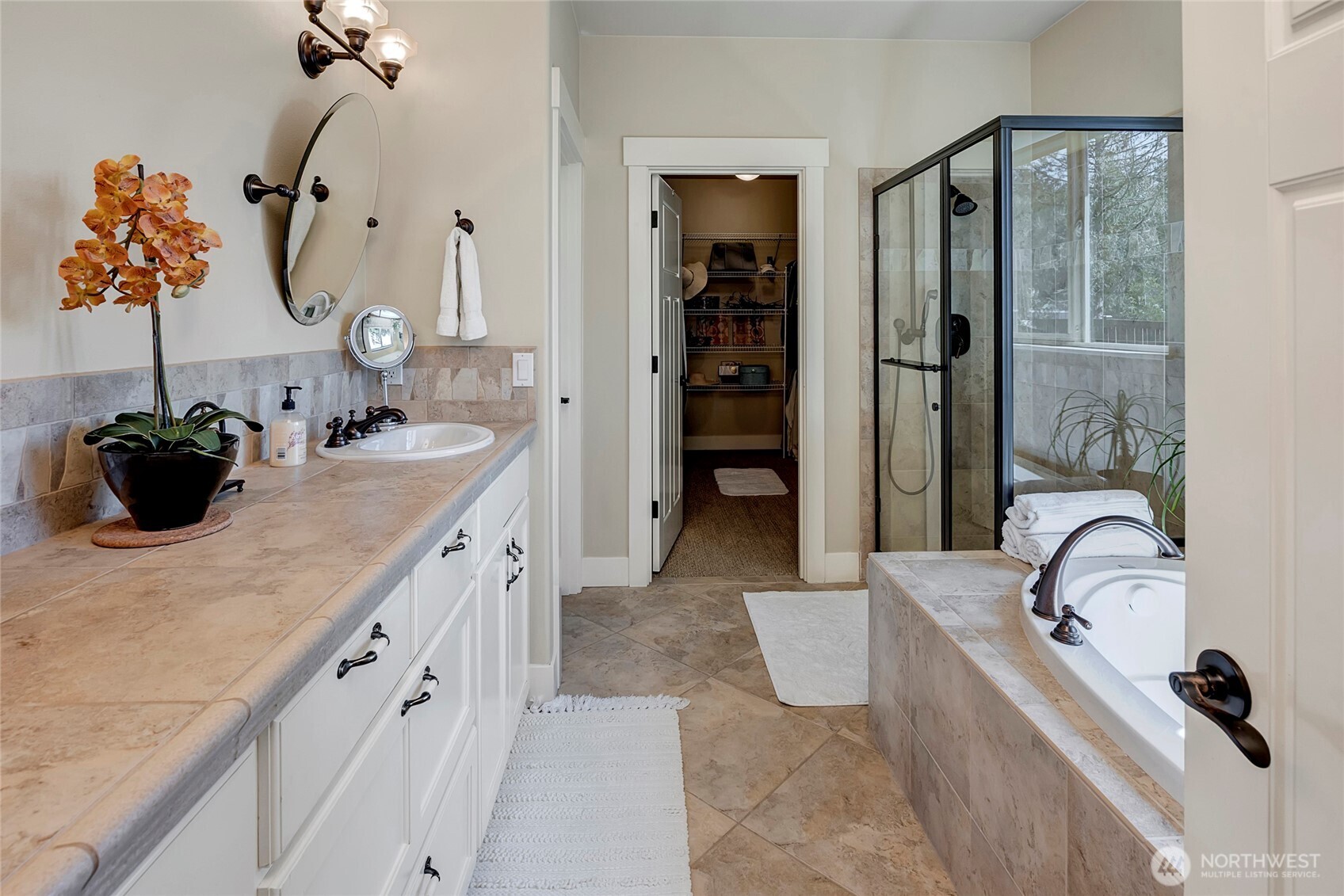 8211 Spada Road Snohomish, WA 98290 - Photo 17 of 35 a bathroom with a double vanity sink mirror and shower