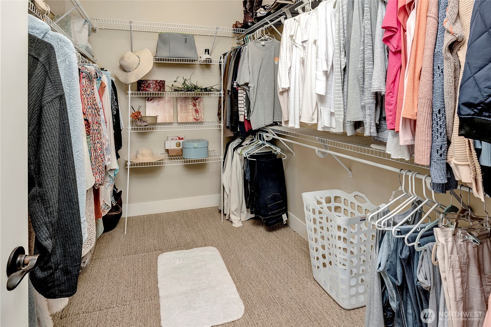 8211 Spada Road Snohomish, WA 98290 - Photo 19 of 35 a view of walk in closet with clothes and shoes