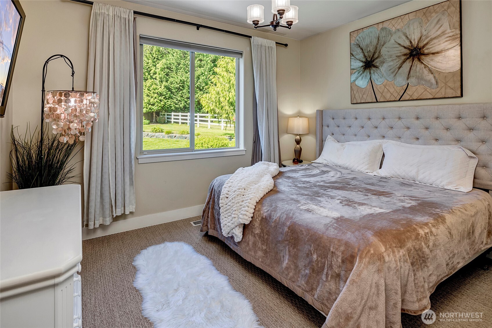 8211 Spada Road Snohomish, WA 98290 - Photo 20 of 35 a bedroom with a bed and a painting on the wall