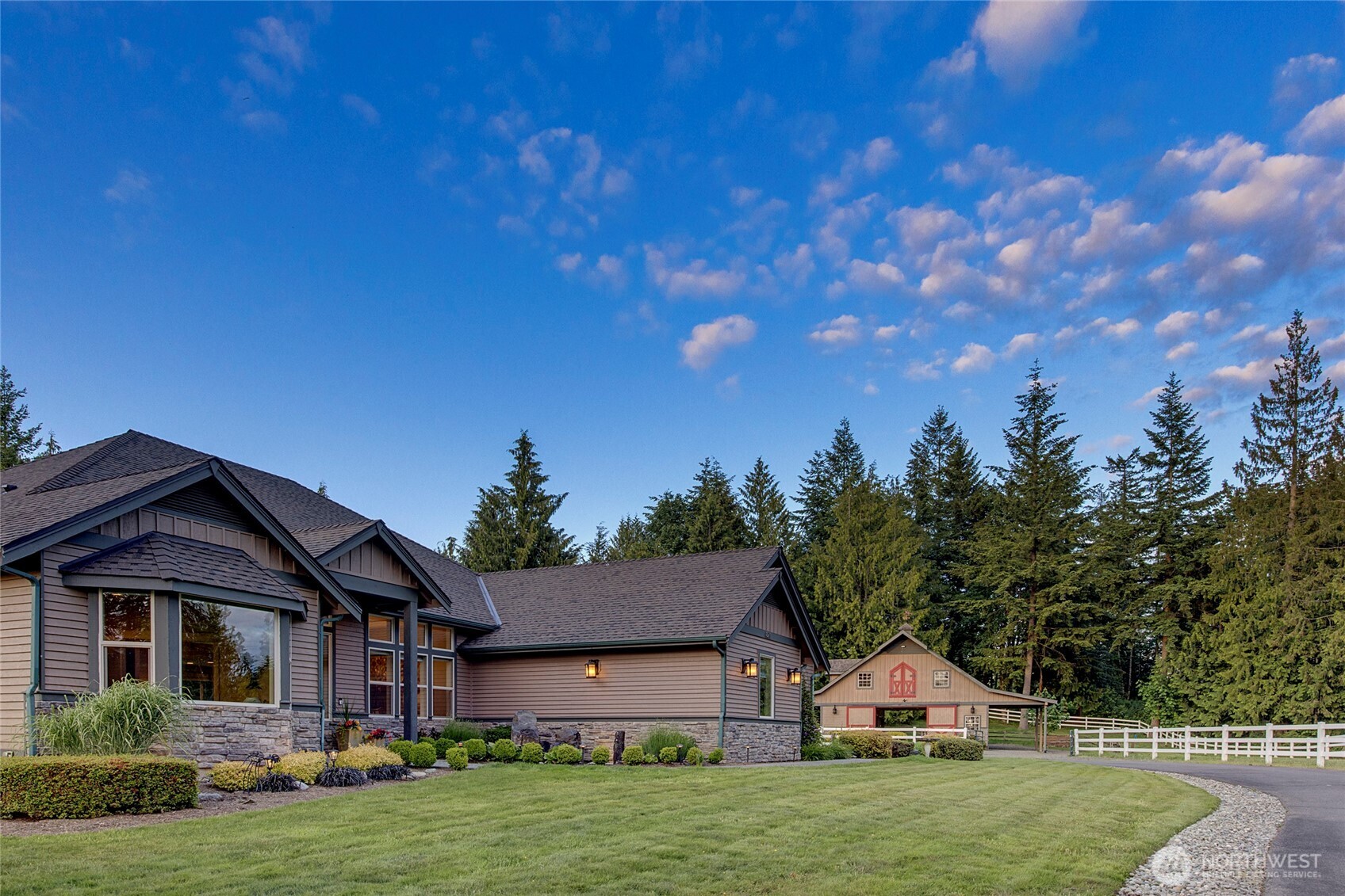 8211 Spada Road Snohomish, WA 98290 - Photo 2 of 35 a front view of a house with a garden and yard
