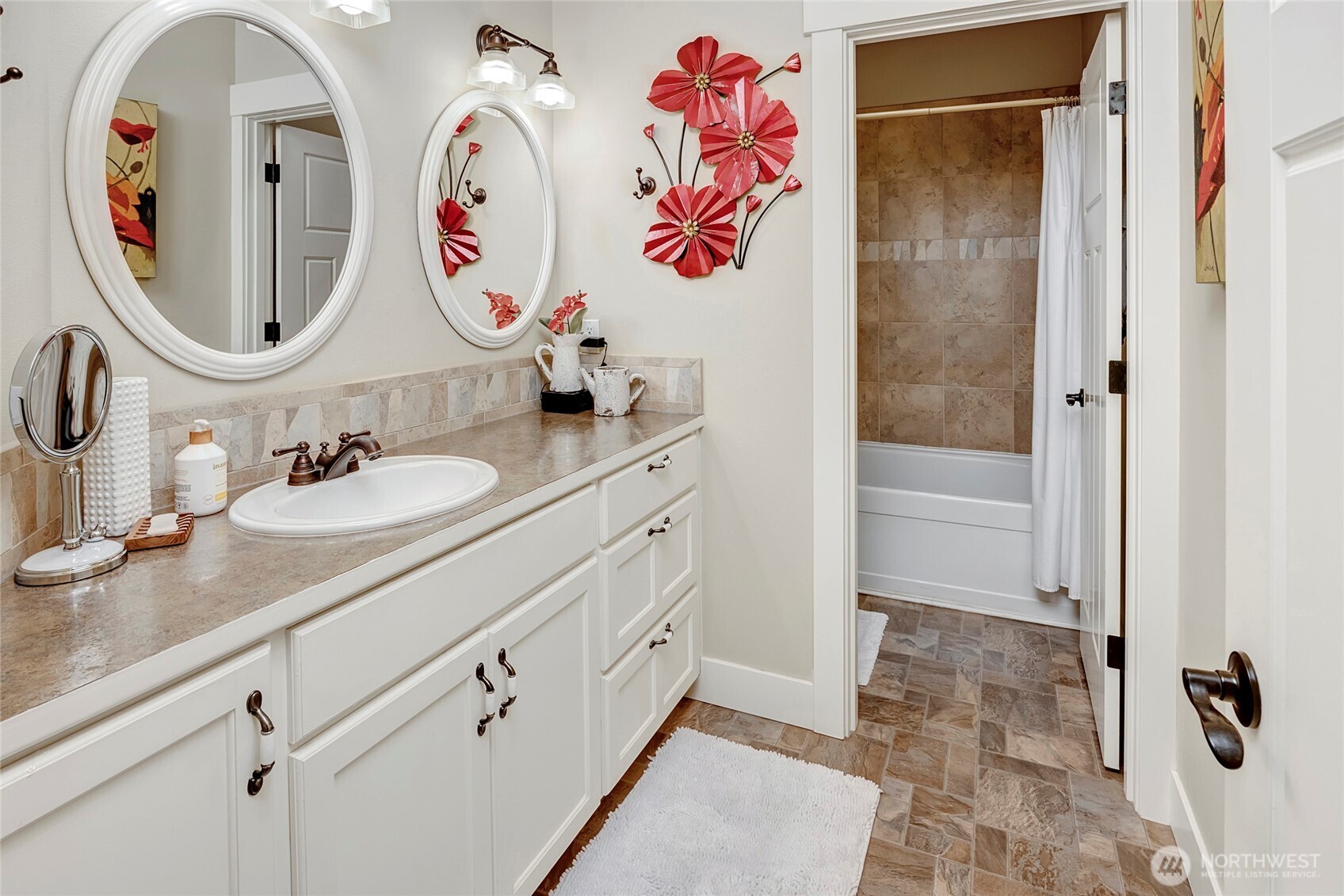 8211 Spada Road Snohomish, WA 98290 - Photo 22 of 35 a bathroom with a sink mirror and double