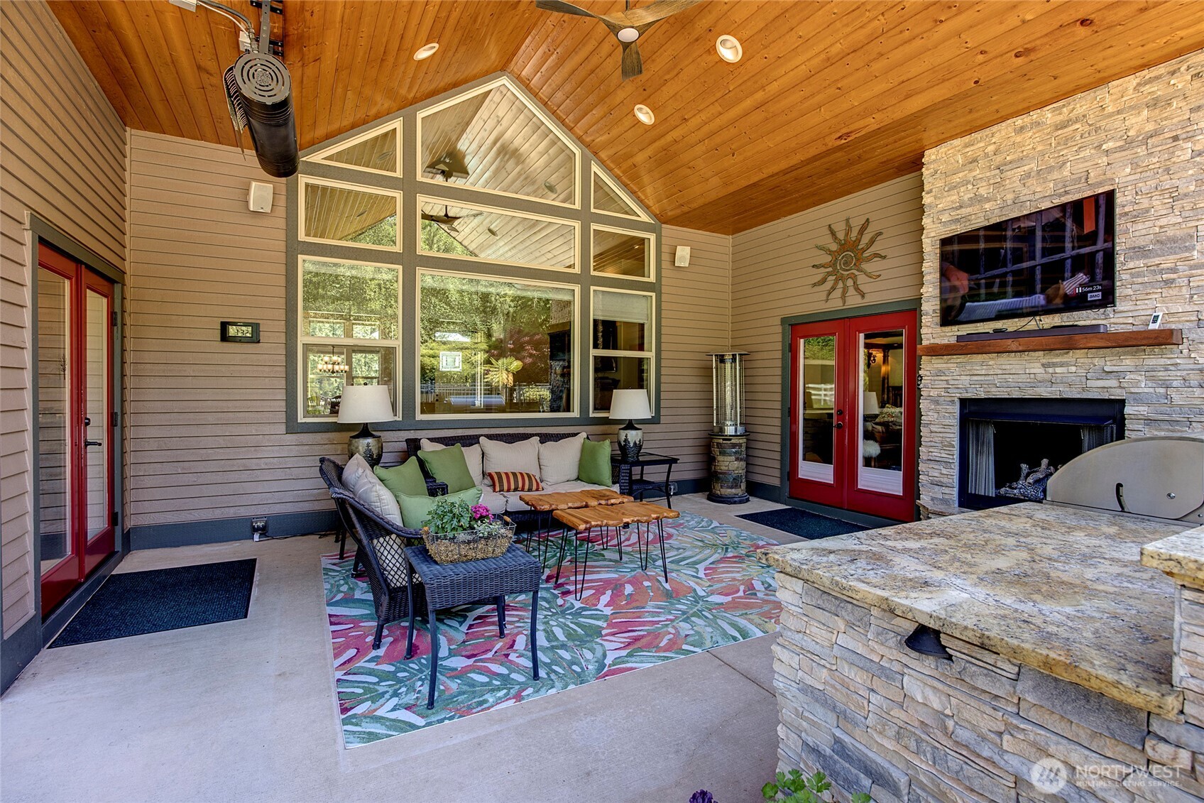 8211 Spada Road Snohomish, WA 98290 - Photo 25 of 35 a outdoor space with furniture and a fireplace
