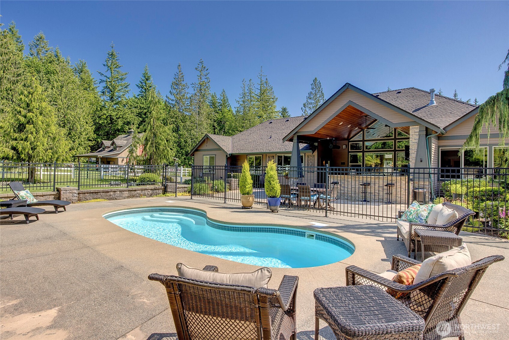 8211 Spada Road Snohomish, WA 98290 - Photo 28 of 35 a view of a house with swimming pool and sitting area