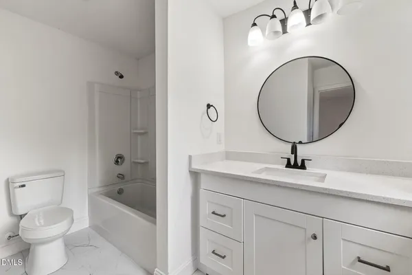 a bathroom with 2 sink and a mirror