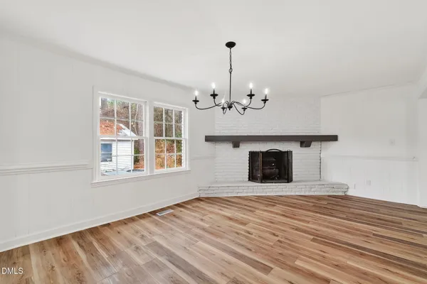 a kitchen with stainless steel appliances a sink dishwasher stove refrigerator and cabinets