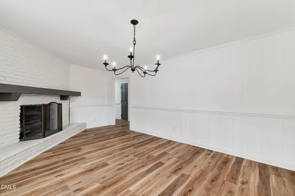a kitchen with stainless steel appliances granite countertop a sink cabinets and wooden floor