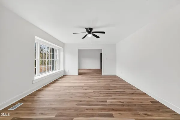 a bathroom with a toilet a sink and a mirror