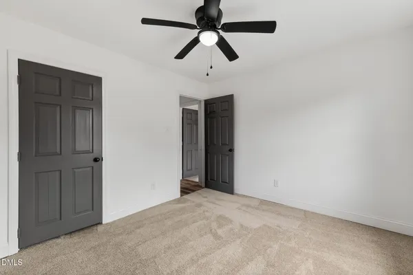 a view of room with ceiling fan