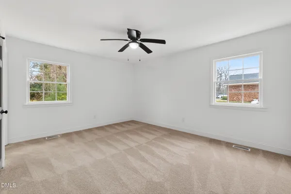 a view of a hallway with a washer and dryer