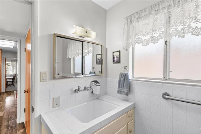a bathroom with a sink and a mirror