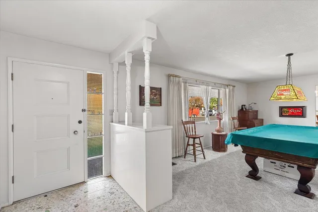 a view of a livingroom with furniture and window