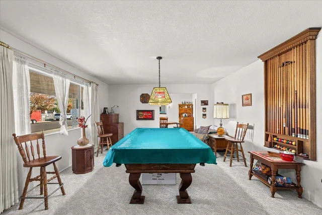 a room with furniture a table and a chandelier