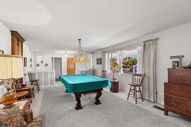 a room with furniture and a large window