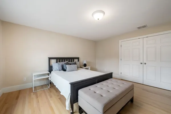 a bedroom with a bed and a table