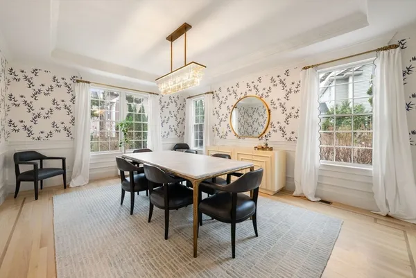 a view of a dining room with furniture window and wooden floor