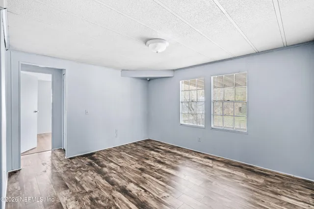 a view of a house with swimming pool and a yard