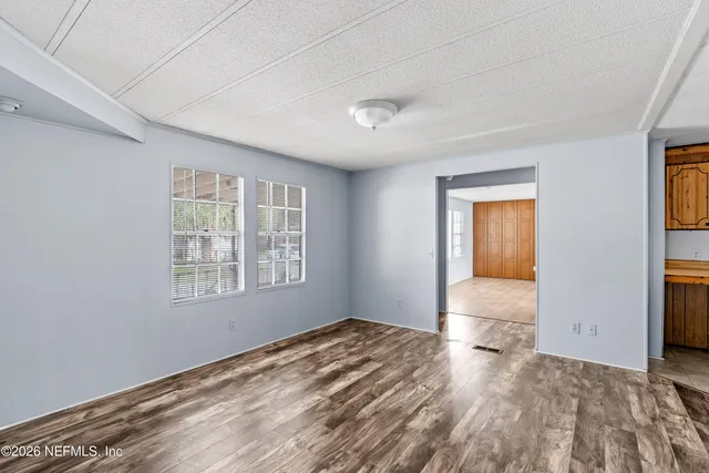 a view of outdoor space with playground and green space